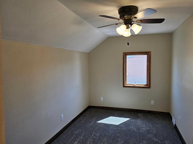 2729 King Ave, Slayton, MN 56172 - bonus room with ceiling fan, dark carpet, vaulted ceiling, and baseboards