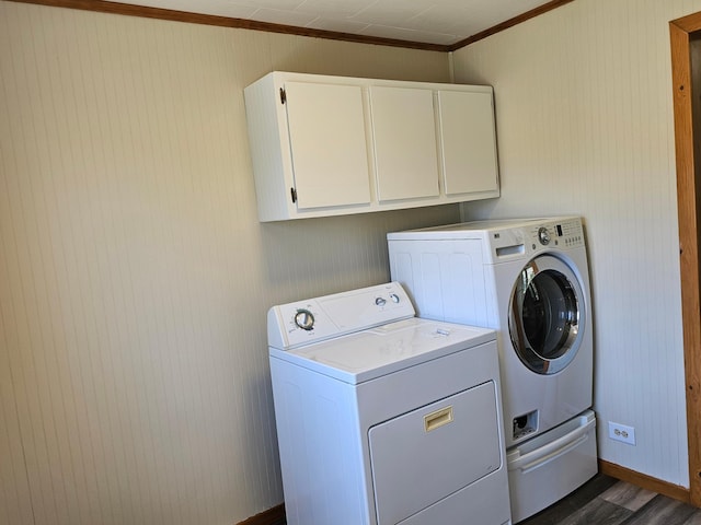 2729 King Ave, Slayton, MN 56172 - washroom with cabinet space, washer and clothes dryer, crown molding, baseboards, and dark wood-type flooring