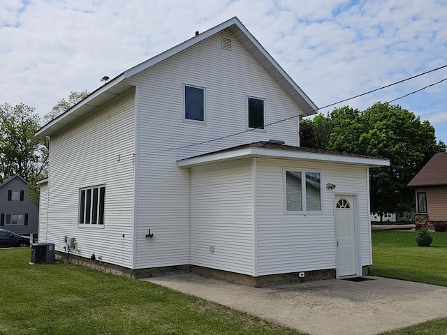 2729 King Ave, Slayton, MN 56172 - rear view of property with cooling unit, a yard, and a patio area