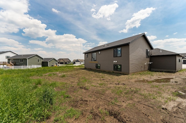 1806 Brandt Dr NE, Byron, MN 55920 - rear view of house with roof with shingles and a residential view
