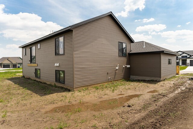 1806 Brandt Dr NE, Byron, MN 55920 - view of home's exterior with a shingled roof