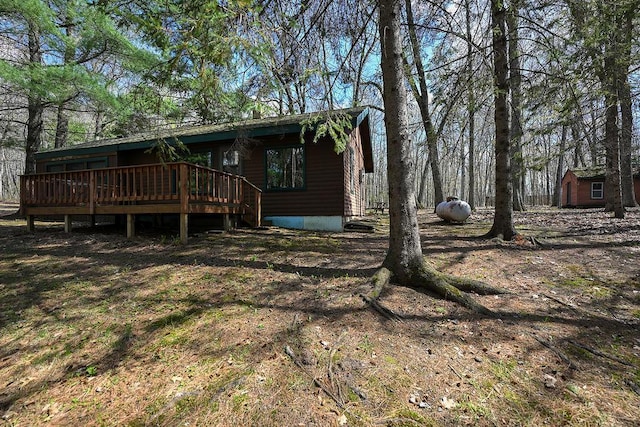 1196 Blackburn Rd, Scott Twp, WI 54801 - view of property exterior with a wooden deck and an outdoor structure