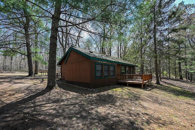 1196 Blackburn Rd, Scott Twp, WI 54801 - view of side of property with a deck and a view of trees