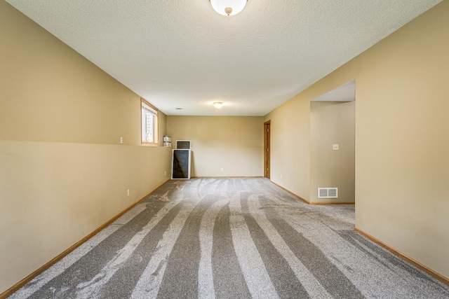 121 Yorkton Rdg, Little Canada, MN 55117 - unfurnished living room featuring carpet floors, a textured ceiling, and baseboards