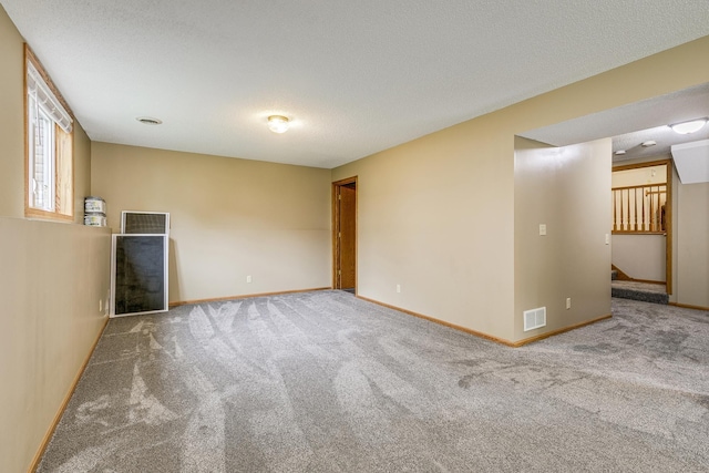 121 Yorkton Rdg, Little Canada, MN 55117 - carpeted empty room featuring baseboards, a textured ceiling, and stairs
