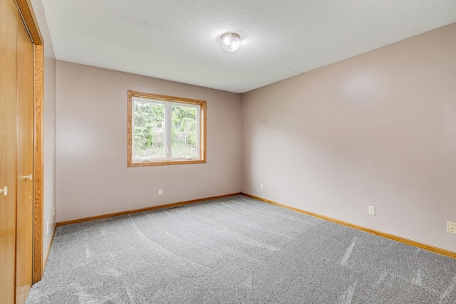 121 Yorkton Rdg, Little Canada, MN 55117 - carpeted spare room featuring baseboards and a textured ceiling
