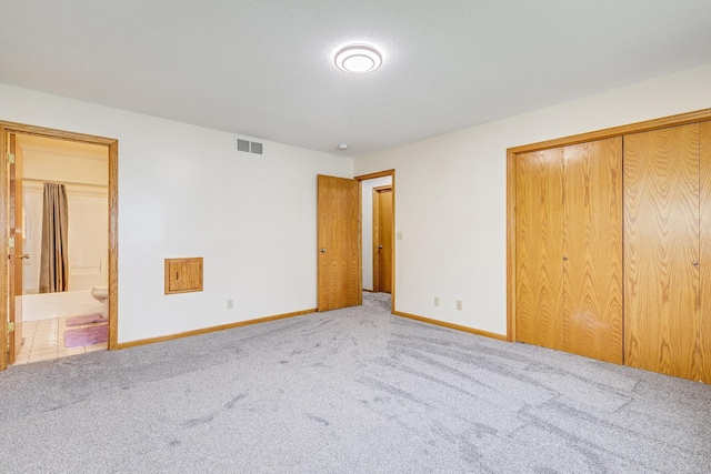121 Yorkton Rdg, Little Canada, MN 55117 - unfurnished bedroom with carpet flooring, baseboards, connected bathroom, and a closet