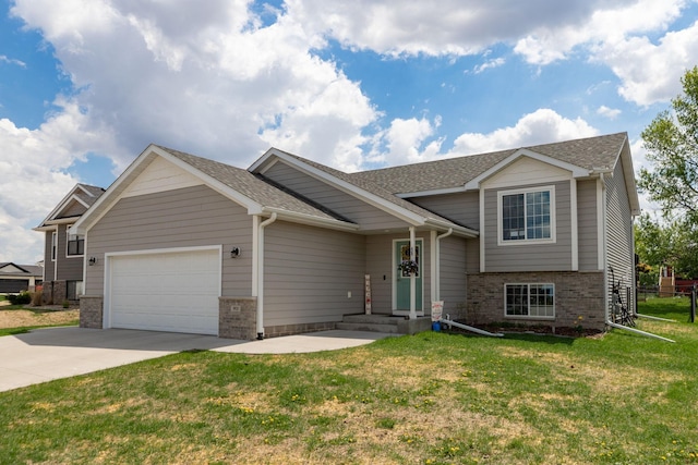802 10th St NE, Kasson, MN 55944 - split level home with brick siding, a garage, concrete driveway, a front lawn, and a shingled roof