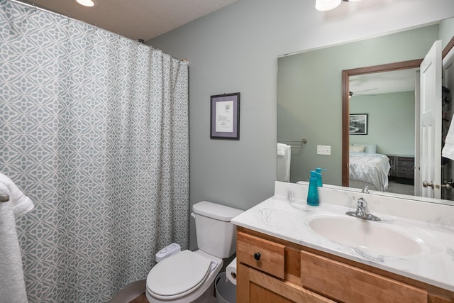802 10th St NE, Kasson, MN 55944 - ensuite bathroom featuring toilet, vanity, and curtained shower