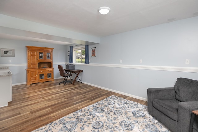 802 10th St NE, Kasson, MN 55944 - living area featuring light wood-type flooring, baseboards, and an office area