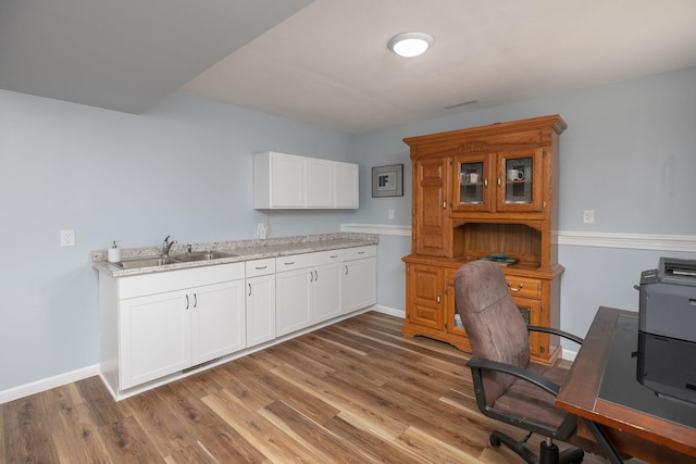 802 10th St NE, Kasson, MN 55944 - office featuring a sink, wood finished floors, and baseboards