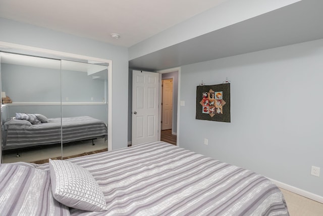 802 10th St NE, Kasson, MN 55944 - carpeted bedroom with a closet and baseboards