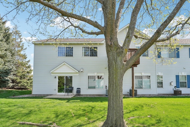 6509 154th St W, Apple Valley, MN 55124 - back of house with central AC, a patio area, and a lawn