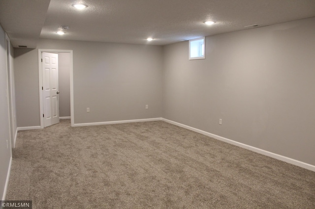 1310 Pacific St, Saint Paul, MN 55106 - basement featuring carpet, a textured ceiling, baseboards, and recessed lighting