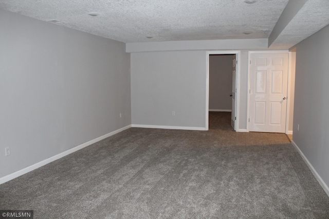 1310 Pacific St, Saint Paul, MN 55106 - unfurnished room with a textured ceiling, dark carpet, and baseboards