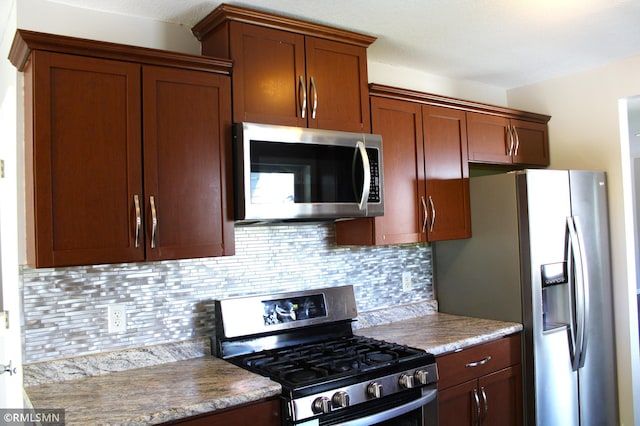 1310 Pacific St, Saint Paul, MN 55106 - kitchen featuring appliances with stainless steel finishes and decorative backsplash