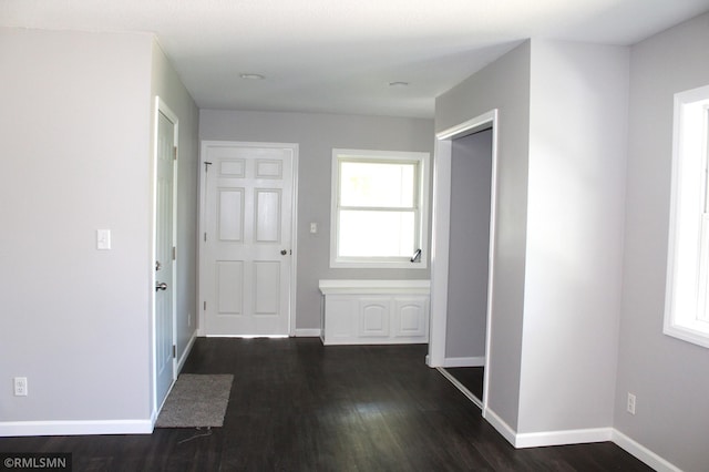 1310 Pacific St, Saint Paul, MN 55106 - hallway with dark wood-style flooring and baseboards