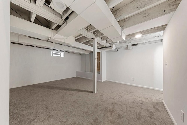 basement featuring carpet and baseboards