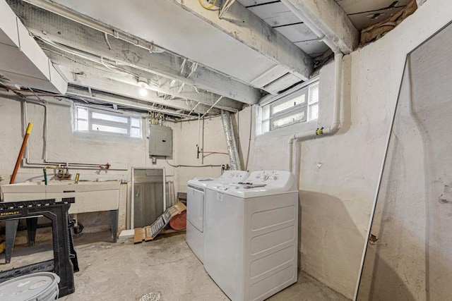 basement with independent washer and dryer, electric panel, and healthy amount of natural light