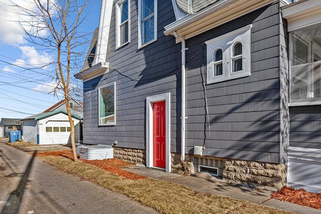 view of exterior entry with a garage