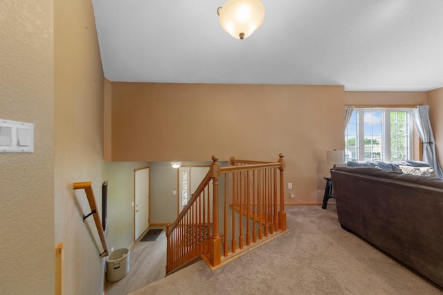 staircase with carpet and baseboards