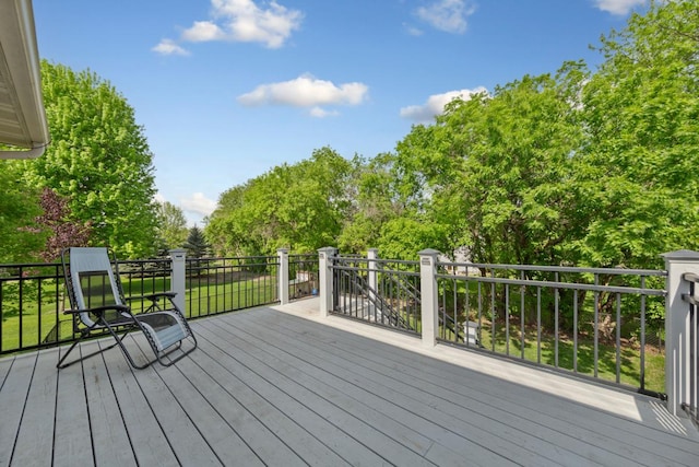 wooden terrace with view of scattered trees