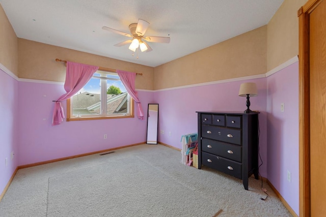 bedroom featuring carpet, baseboards, and a ceiling fan