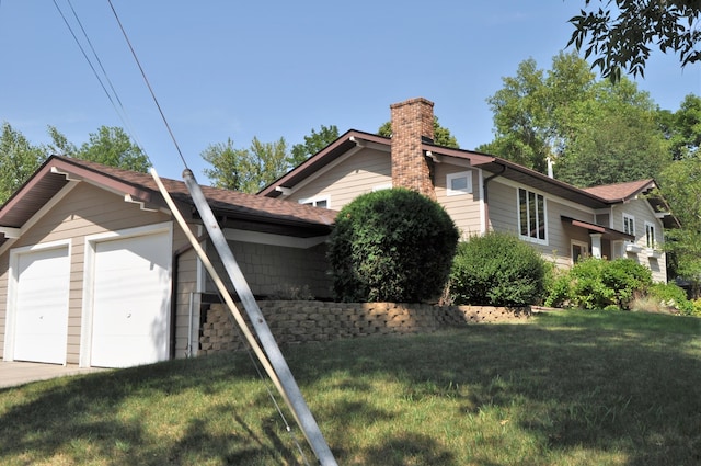 1401 5th St, Montevideo, MN 56265 - view of side of home with a chimney, a garage, a lawn, and roof with shingles