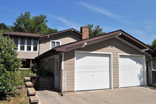 1401 5th St, Montevideo, MN 56265 - view of front facade featuring a garage and a chimney