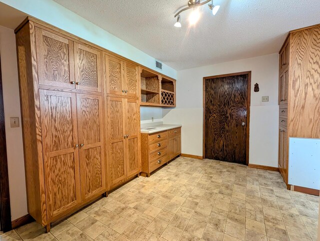 1401 5th St, Montevideo, MN 56265 - mudroom with a textured ceiling and baseboards