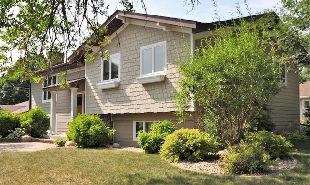1401 5th St, Montevideo, MN 56265 - view of home's exterior with a lawn