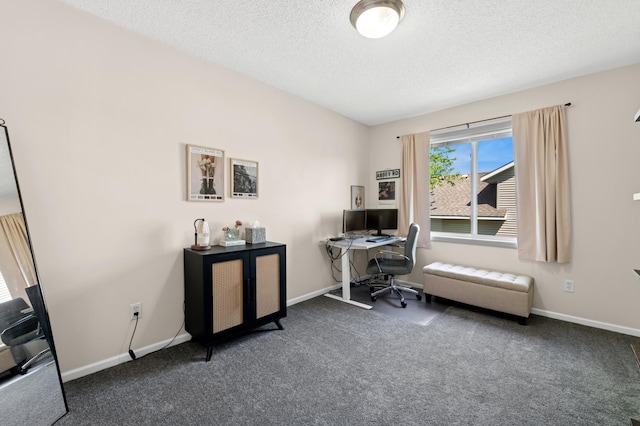 home office featuring carpet floors, a textured ceiling, and baseboards