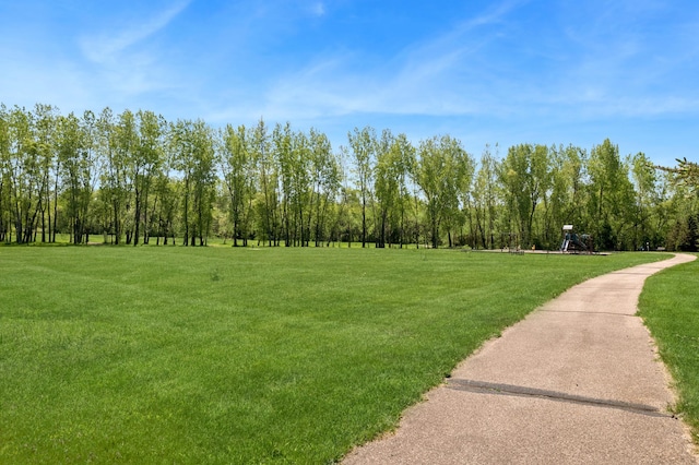 surrounding community featuring a lawn