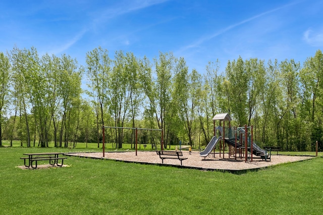 community jungle gym featuring a yard