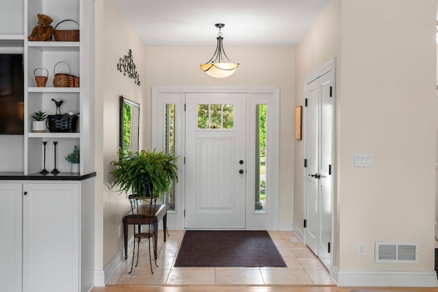 855 Elins Lake Rd SE, Cambridge, MN 55008 - foyer entrance featuring light tile patterned floors and baseboards