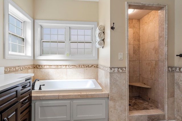 855 Elins Lake Rd SE, Cambridge, MN 55008 - full bathroom with tile walls, a tile shower, a bath, and wainscoting