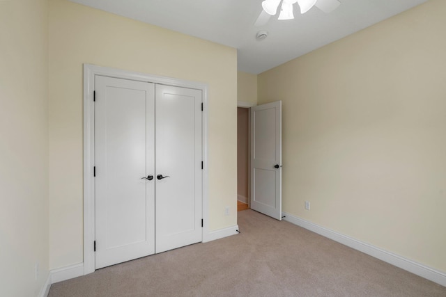 855 Elins Lake Rd SE, Cambridge, MN 55008 - unfurnished bedroom with light carpet, baseboards, a closet, and ceiling fan