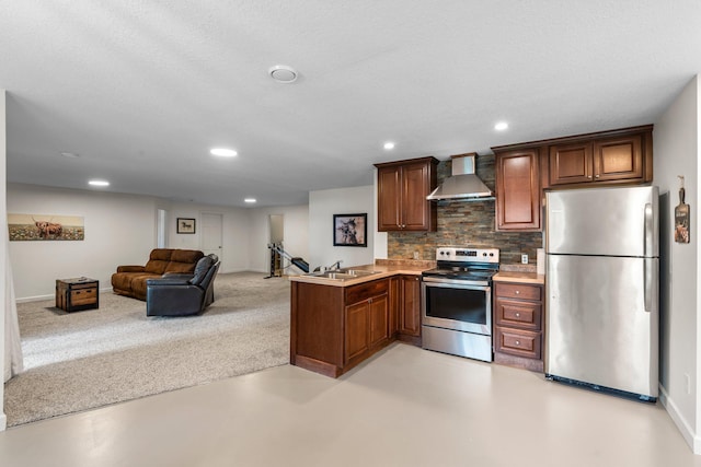 855 Elins Lake Rd SE, Cambridge, MN 55008 - kitchen with stainless steel appliances, wall chimney range hood, decorative backsplash, a sink, and baseboards