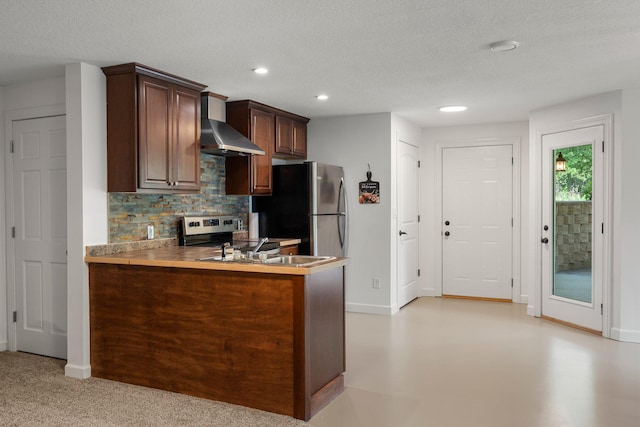 855 Elins Lake Rd SE, Cambridge, MN 55008 - kitchen featuring wall chimney range hood, backsplash, recessed lighting, a textured ceiling, and freestanding refrigerator