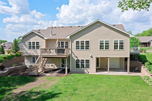 855 Elins Lake Rd SE, Cambridge, MN 55008 - back of property with a patio area, a wooden deck, stairs, a lawn, and an attached garage