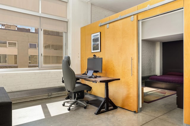 office space with finished concrete flooring and a high ceiling
