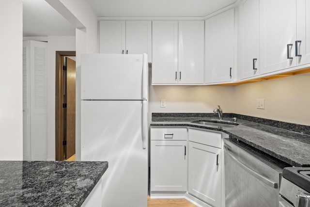 4820 Park Commons Dr Unit 329, Saint Louis Park, MN 55416 - kitchen featuring freestanding refrigerator, stainless steel dishwasher, a sink, and white cabinetry