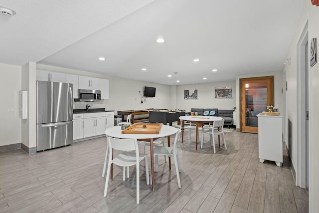 4820 Park Commons Dr Unit 329, Saint Louis Park, MN 55416 - dining room with light wood-type flooring, recessed lighting, and baseboards
