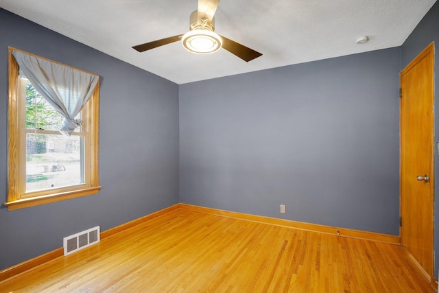 4528 6th St NE, Columbia Heights, MN 55421 - empty room with a ceiling fan, wood finished floors, baseboards, and a smoke detector