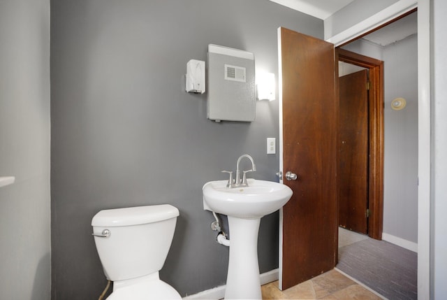 4528 6th St NE, Columbia Heights, MN 55421 - half bath featuring toilet and baseboards