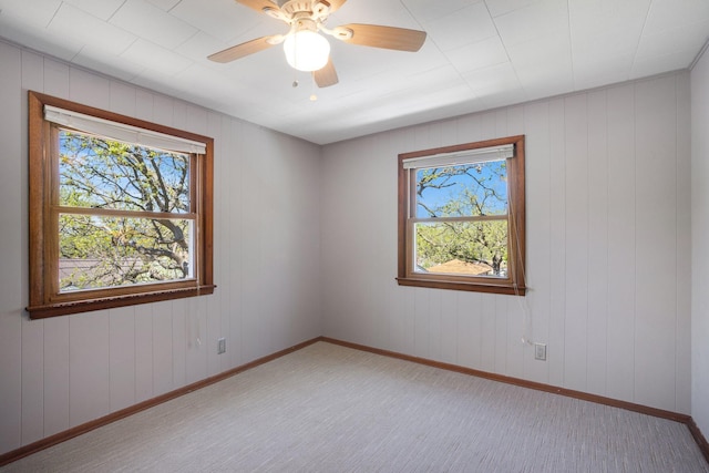 4528 6th St NE, Columbia Heights, MN 55421 - unfurnished room featuring baseboards, light colored carpet, and a ceiling fan