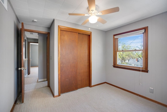 4528 6th St NE, Columbia Heights, MN 55421 - unfurnished bedroom with light colored carpet, a closet, baseboards, and a ceiling fan
