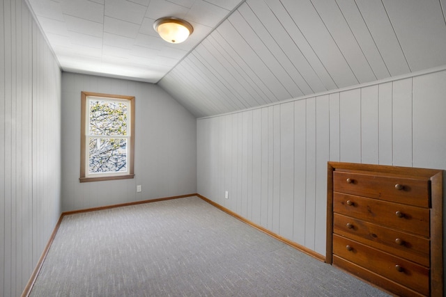 4528 6th St NE, Columbia Heights, MN 55421 - bonus room with carpet flooring, vaulted ceiling, baseboards, and wood walls