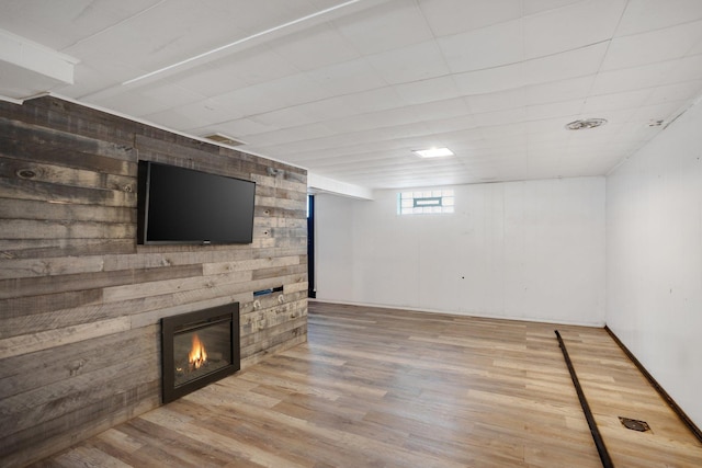 4528 6th St NE, Columbia Heights, MN 55421 - basement with a glass covered fireplace and wood finished floors