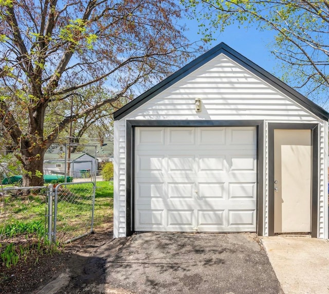 4528 6th St NE, Columbia Heights, MN 55421 - detached garage featuring fence and concrete driveway